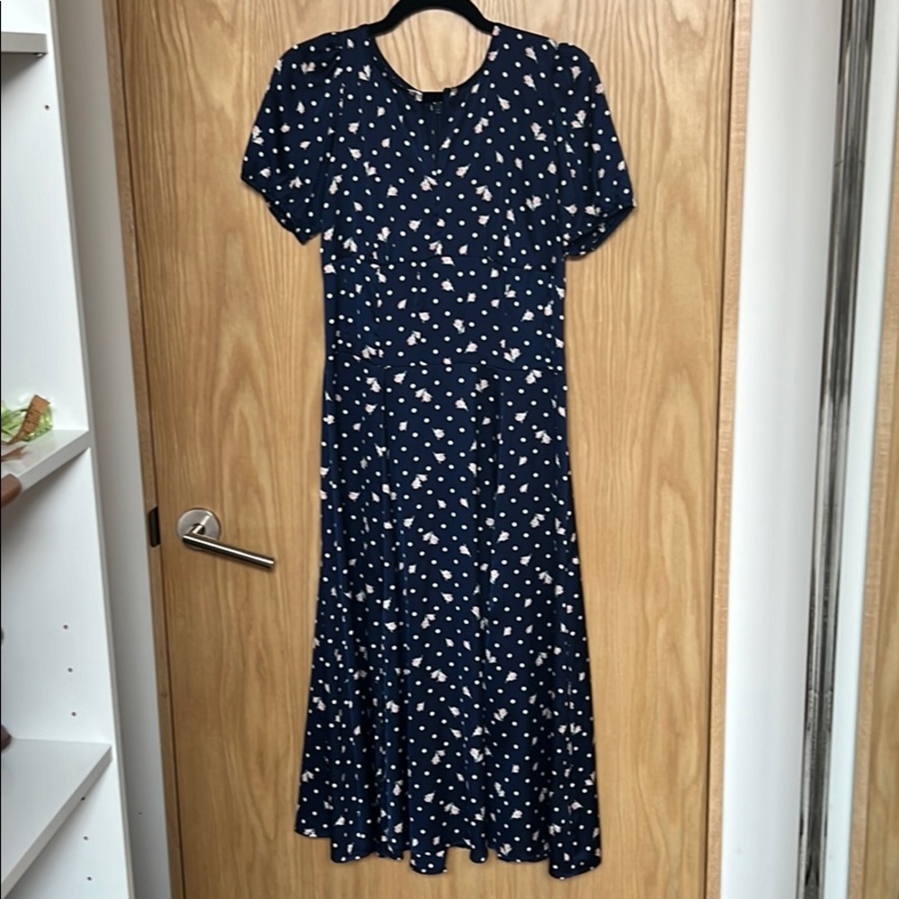 Eva Mendes Navy dot dress, puff sleeve, fit flair